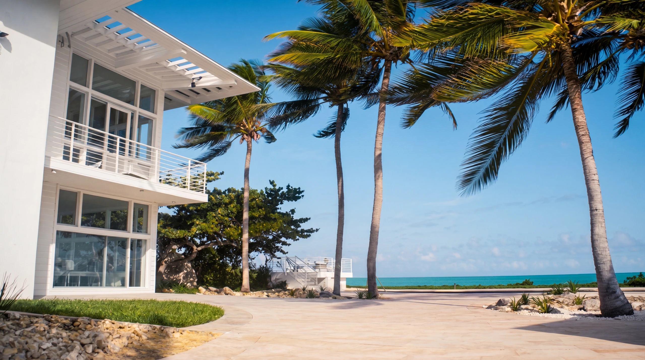 Coastal Key Biscayne modern home with palms and ocean view