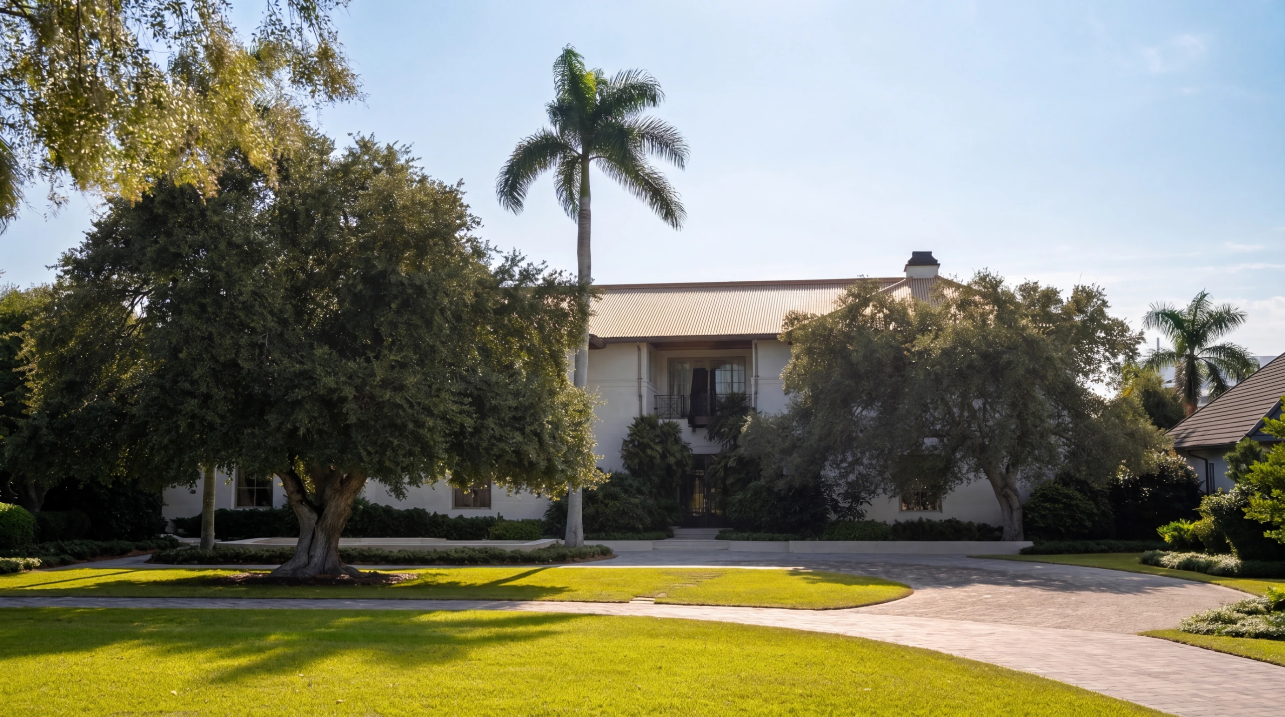 Pinecrest Florida estate home with mature trees and circular driveway