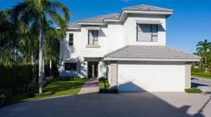 Clean South Florida home exterior with tile roof and driveway